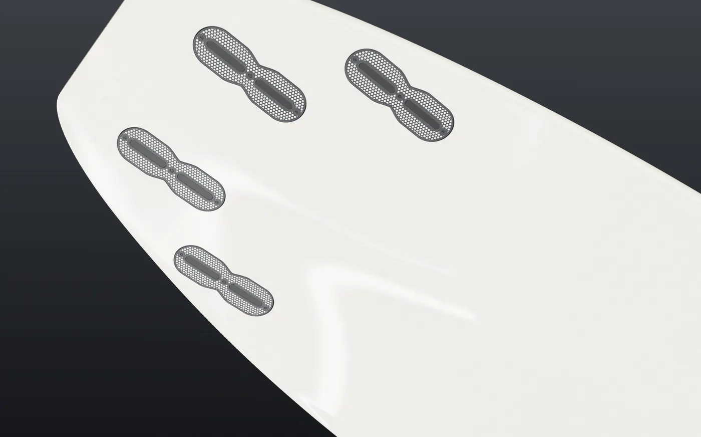 Fin boxes shown at real size on the bottom of a shortboard